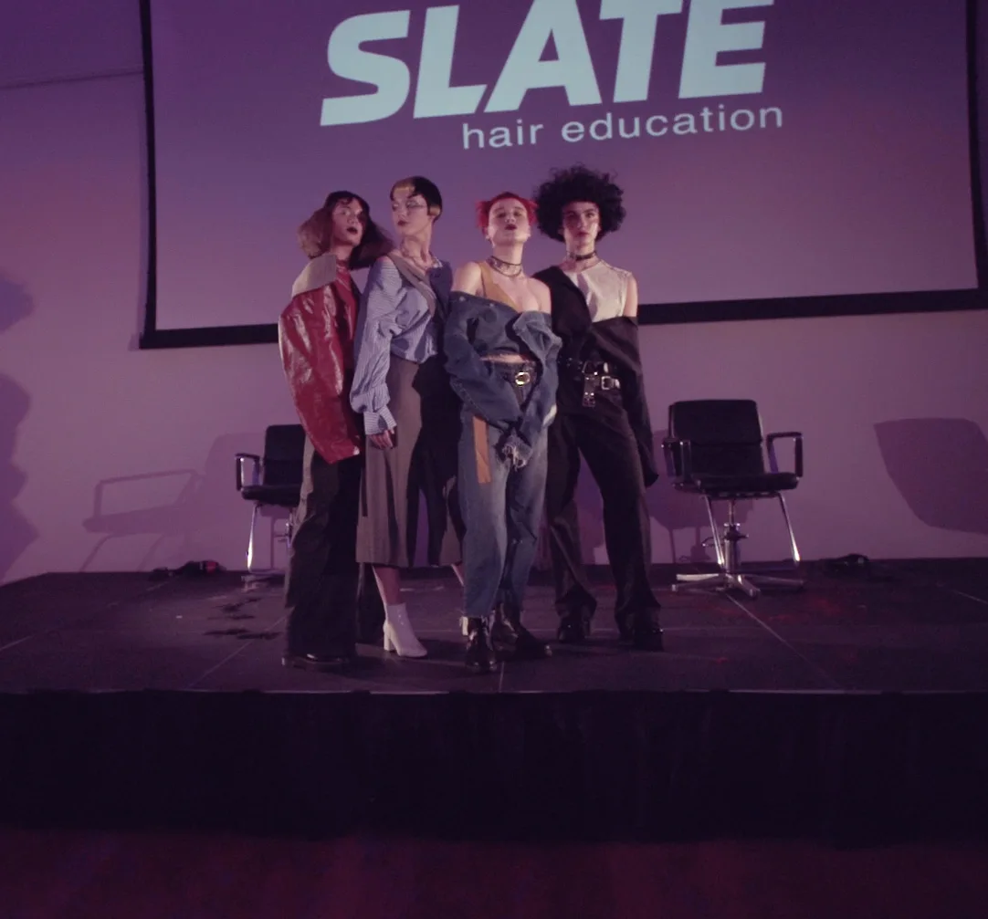 slate hair academy on stage purple act